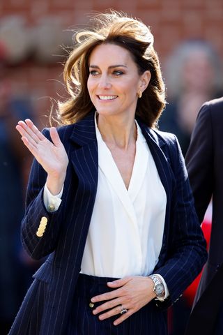 Kate Middleton wears a pinstripe pantsuit and silver Cartier watch