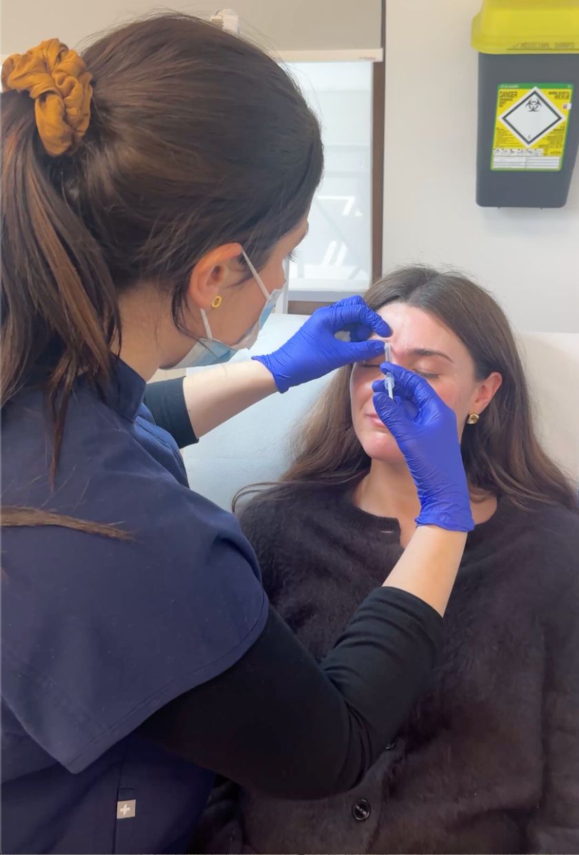 Dr Elizabeth Hawkes doing Eleanor's Botox brow lift treatment in her London clinic