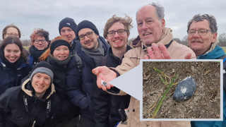 The first fragment of 2024 BX1 recovered by the Natural History Museum/DLR/Freie Universtaet Berlin team. Right in the image is team lead Lutz Hecht, while guide SETI Institute meteor astronomer Peter Jenniskens shows the fragment discovered by student Dominique Dieter left of him. Far left is student Clara Weihe who found the second meteorite.
