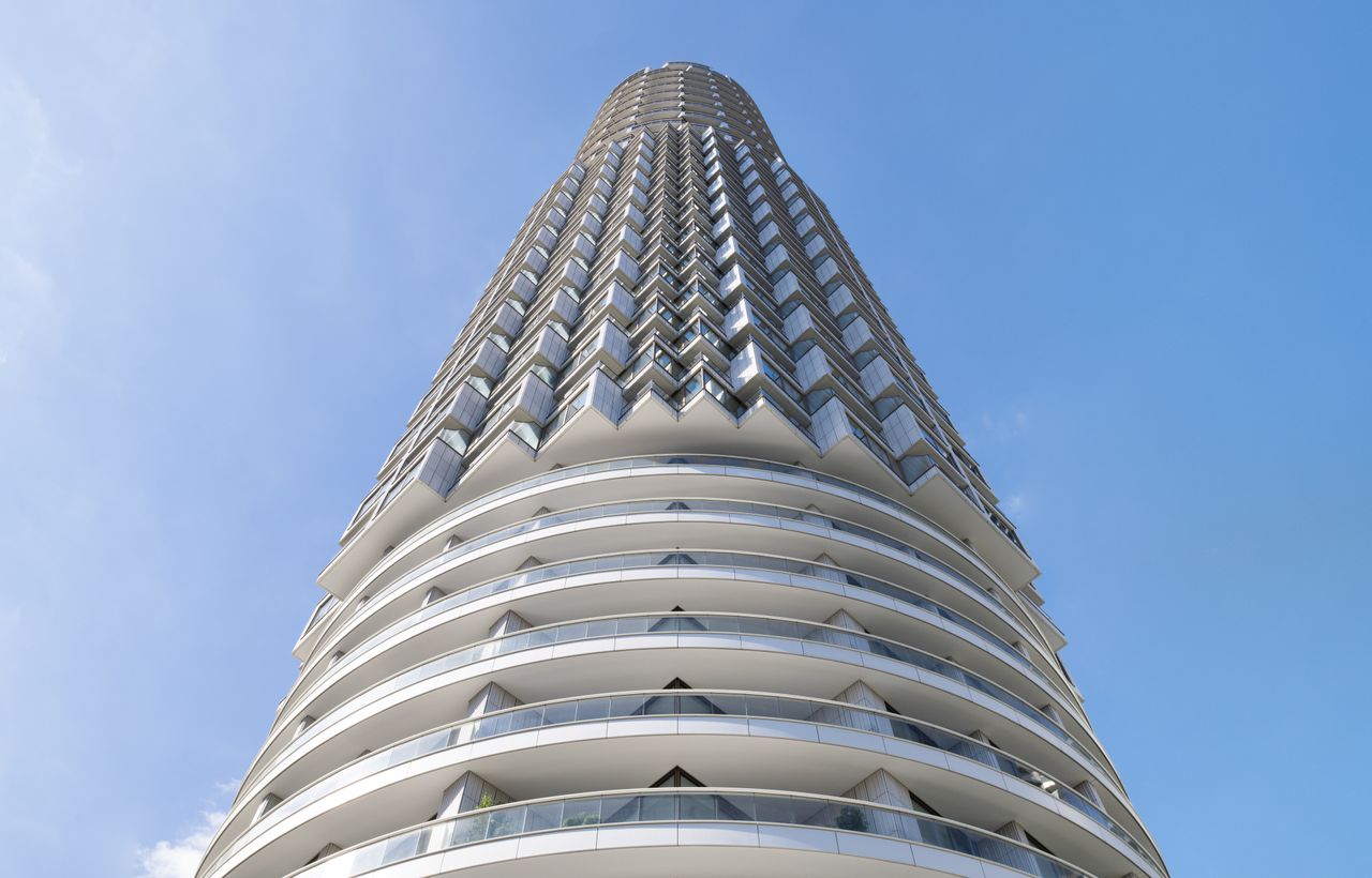 One Park Drive hero shot looking up against blue sky