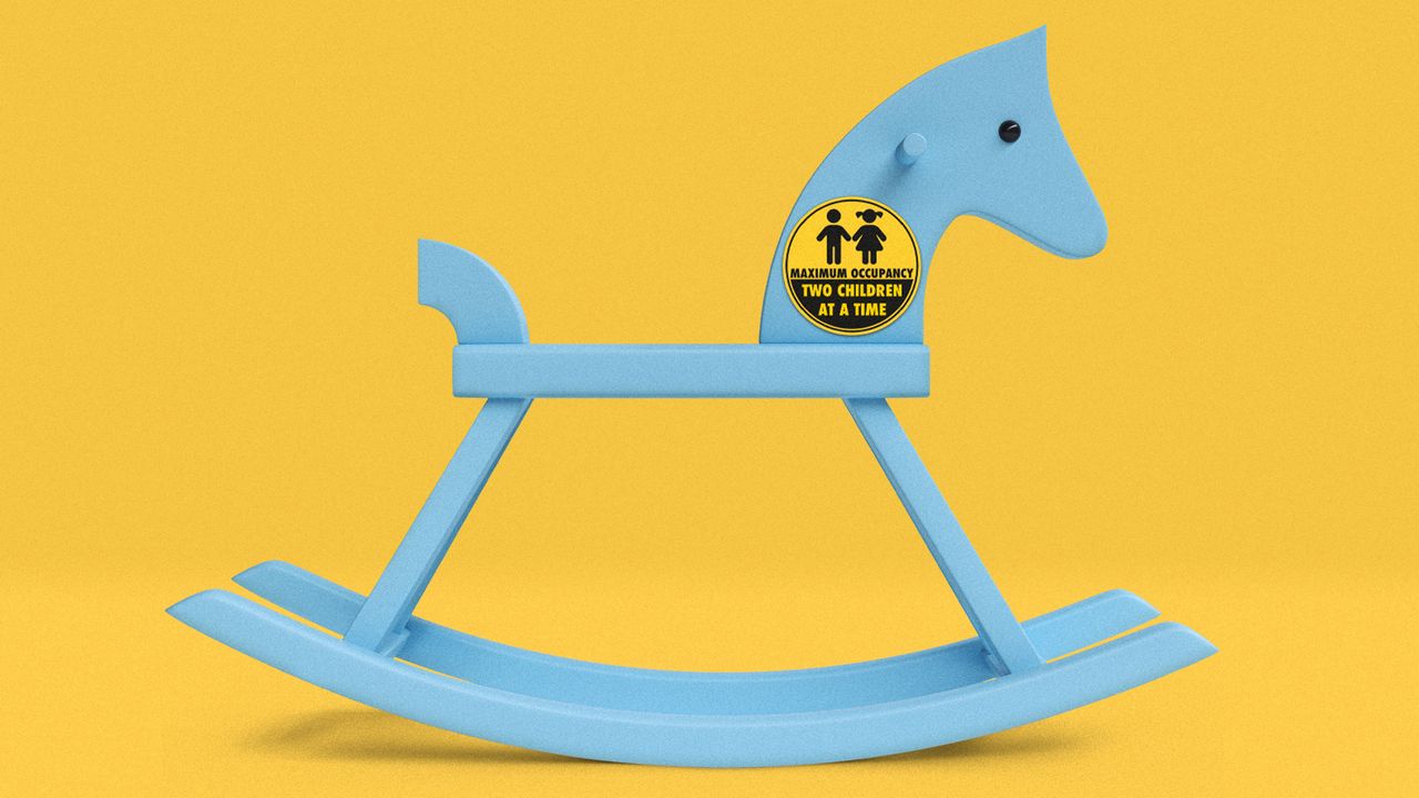 Children&#039;s rocking horse with a two-child limit sign