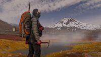Screenshot from DayZ Frostline: A Man in arctic survival gear stands in front of a steaming sulfur pot with a snowy volcano cone in the background
