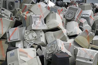 A pile of discarded computer monitors