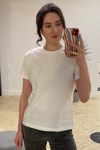 An image of Who What Wear UK news writer, Natalie Munro, wearing one of the best white t-shirts.