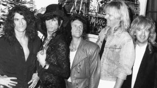 Aerosmith posing for a photograph at the MTV Awards in 1988