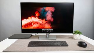 Dell UltraSharp 32 4K Thunderbolt Hub Monitor (U3225QE) on a white desk and gray background.