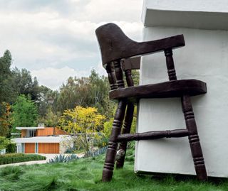 A giant chair embracing a packet of cigarettes, are on display in the garden