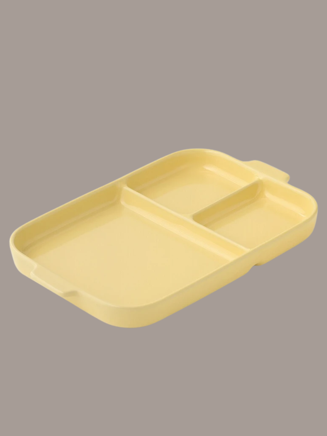 A yellow stoneware divided plate from MUJI