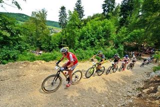 Florian Vogel leads Moritz Milatz on the first lap of the men's race at the Bundesliga round in Albstadt.