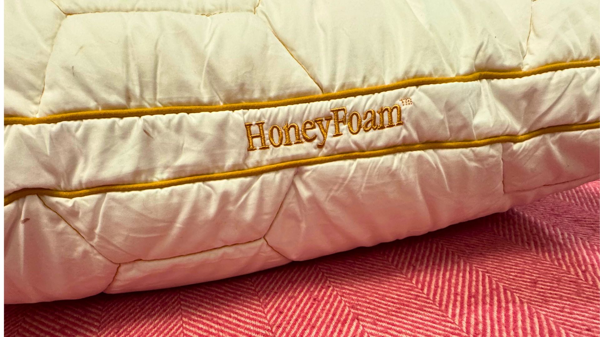 HoneyFoam&amp;trade; Adjustable Pillow Review - the pillow pictured on a bed during testing