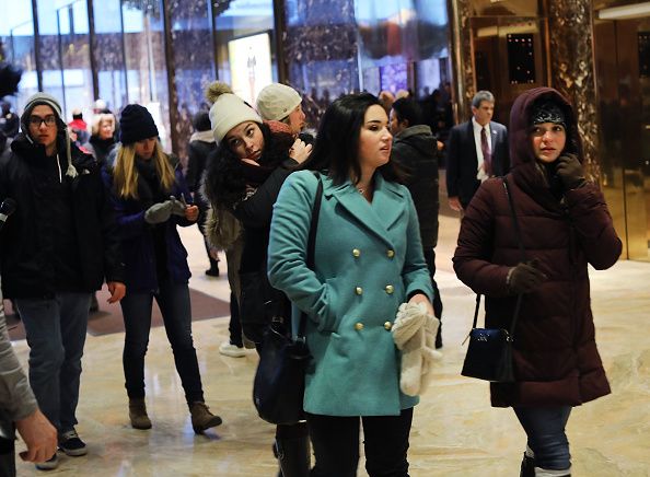 Tourists visit the lobby of Trump Tower.