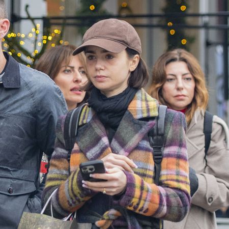 Lily Collins wearing a plaid coat