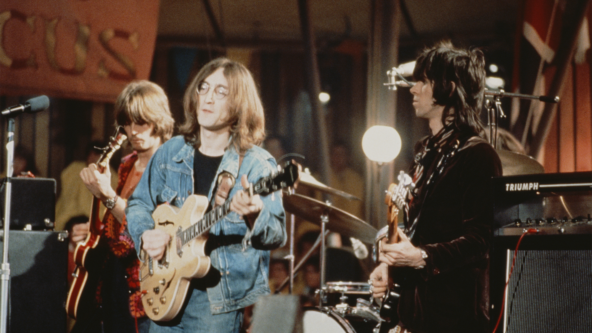From left to right: Eric Clapton, John Lennon (1940 - 1980) and Keith Richards perform live on stage as The Dirty Mac on the set of the Rolling Stones Rock and Roll Circus at Intertel TV Studio in Wembley, London on 11th December 1968.