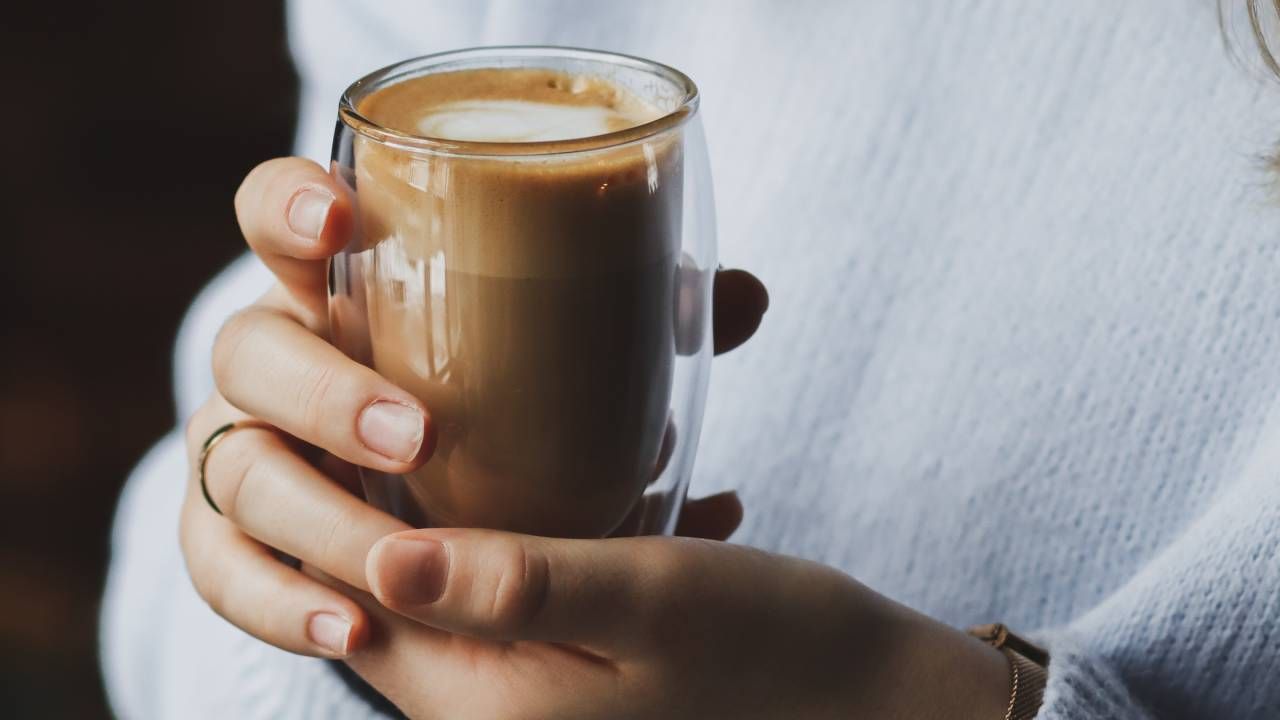 Woman holding a cup of coffee