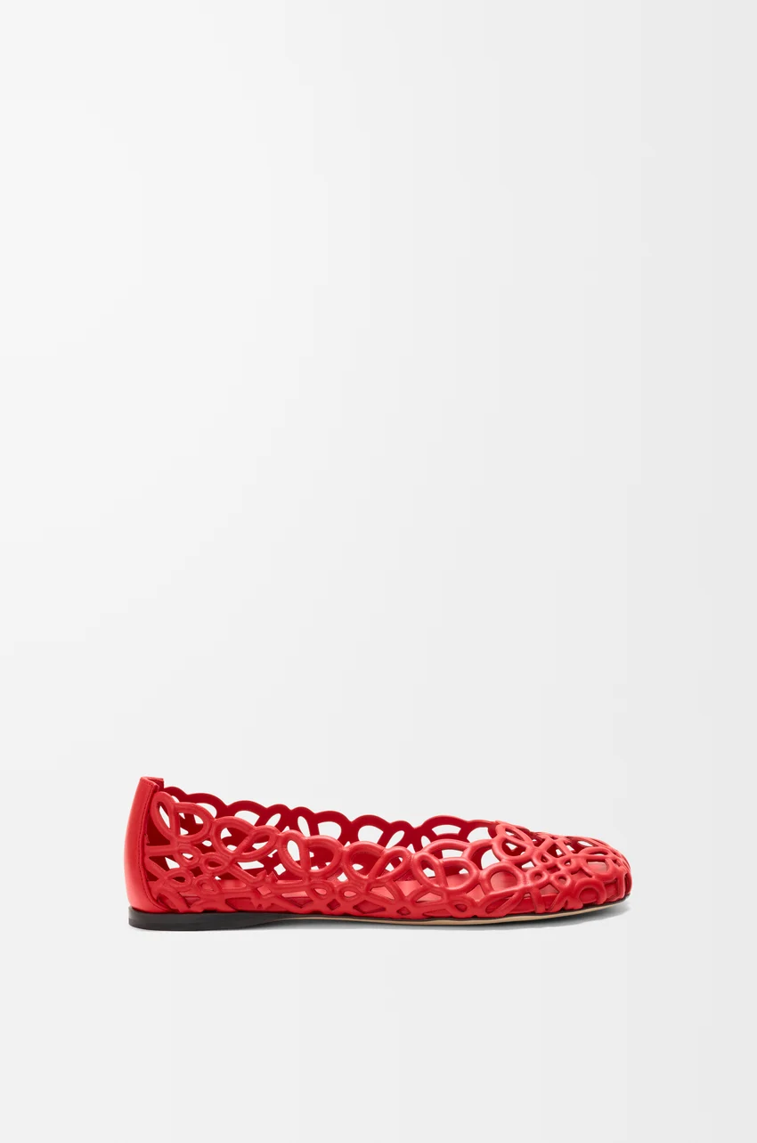 A pair of red woven Loewe ballet flats.