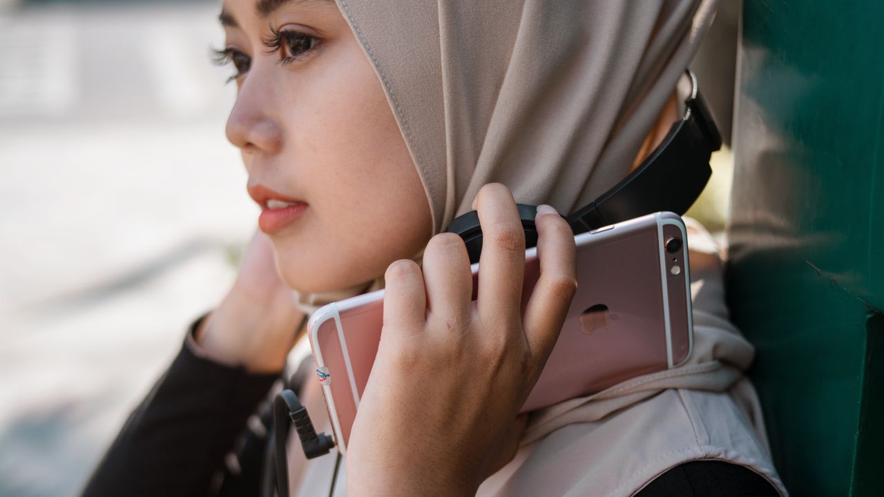 Woman holding an iPhone