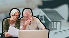 Couple look at paper and laptop as they plan for inheritance tax.