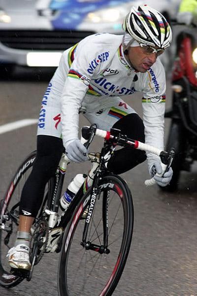 A bundled up Bettini faces the horrid weather