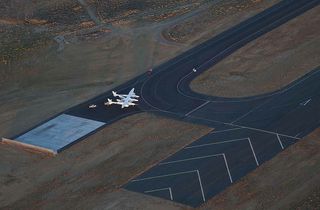 Virgin Galactic's WhiteKnightTwo carrier aircraft and the SpaceShipTwo suborbital spacecraft prepare for the first drop and glide test of SpaceShipTwo on Oct. 10, 2010.