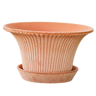 A ceramic fluted pot and saucer set