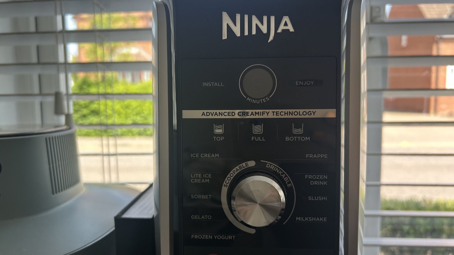 Ninja Creami ice cream maker close up of functions