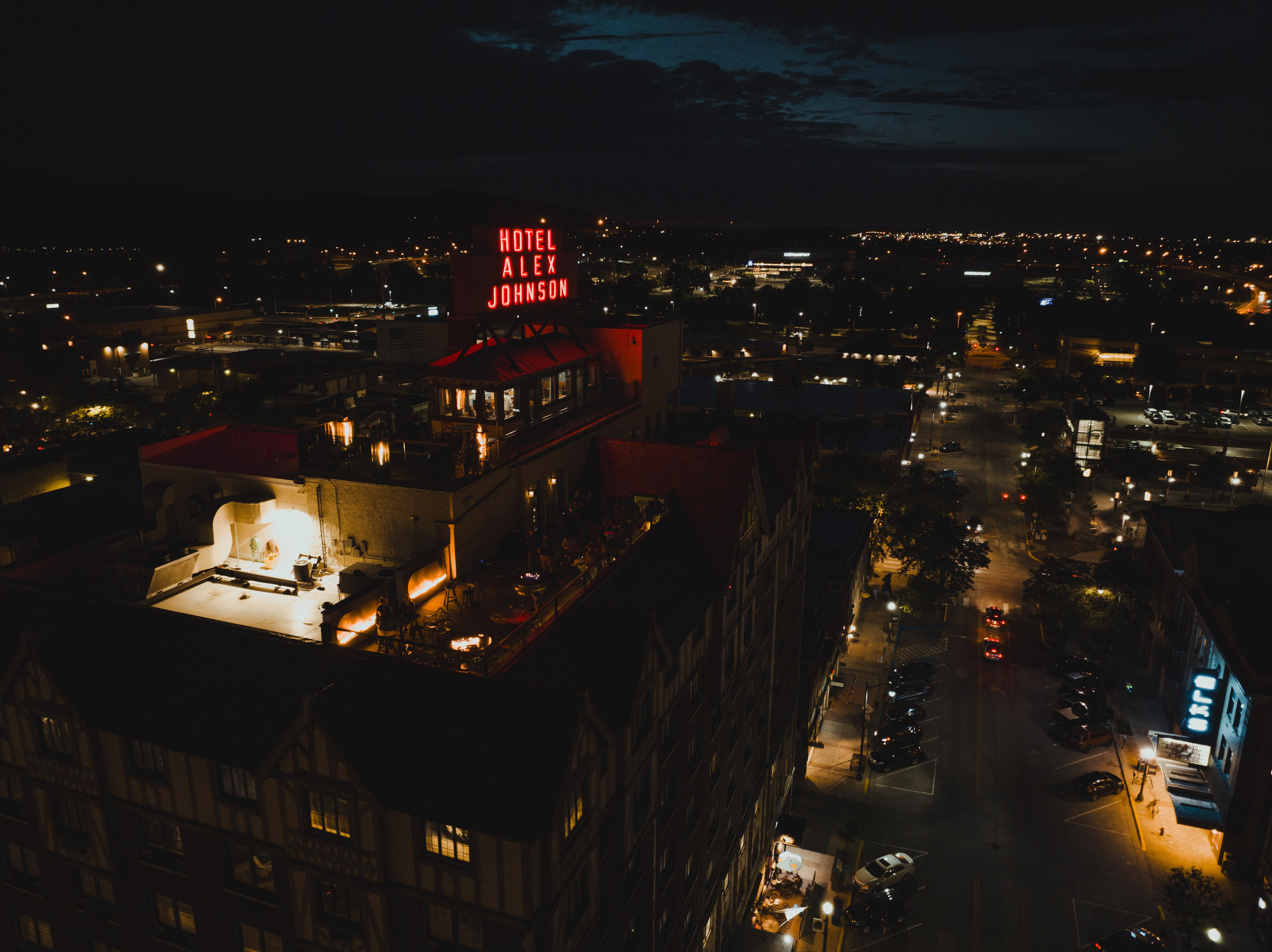 An aerial view of Hotel Alex Johnson at night