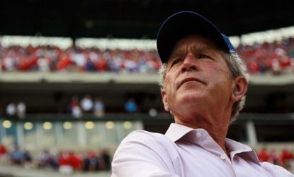 George W. Bush takes in a baseball game in Texas; the former president has laid low after leaving the White House and so declined to join Obama at Ground Zero Thursday.