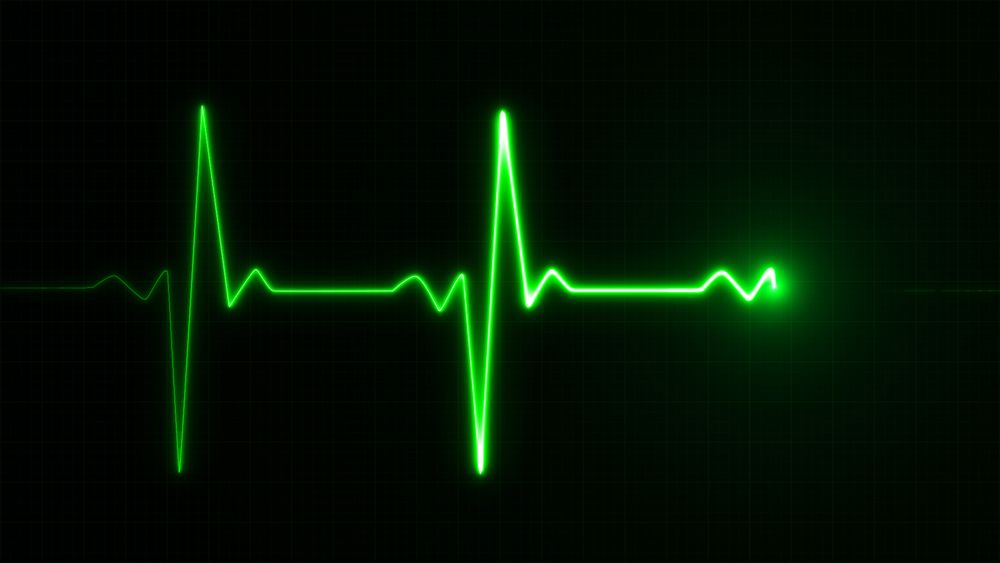 A green heart rate monitor symbol on a black background