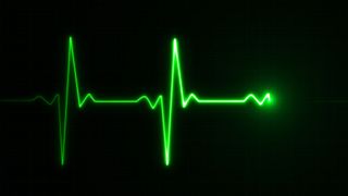 A green heart rate monitor symbol on a black background