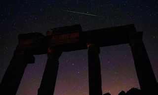 A Perseid meteor streaks across the sky over the ancient city of Blaundus in Usak, Turkey, on Aug. 13, 2020.