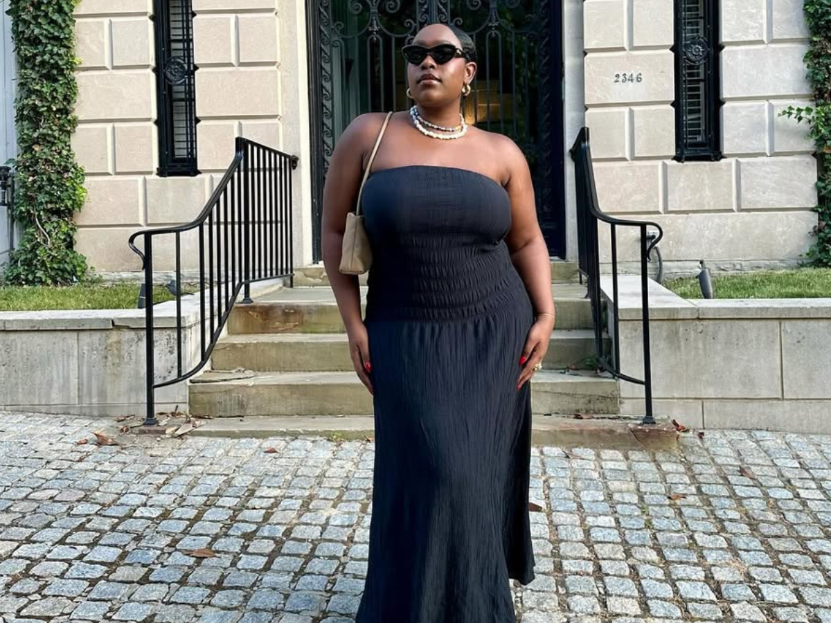 woman wearing black maxi dress and sunglasses