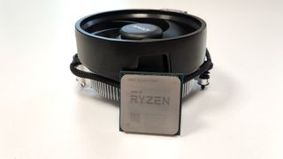 AMD Ryzen 5 5600 proped next to the fan.