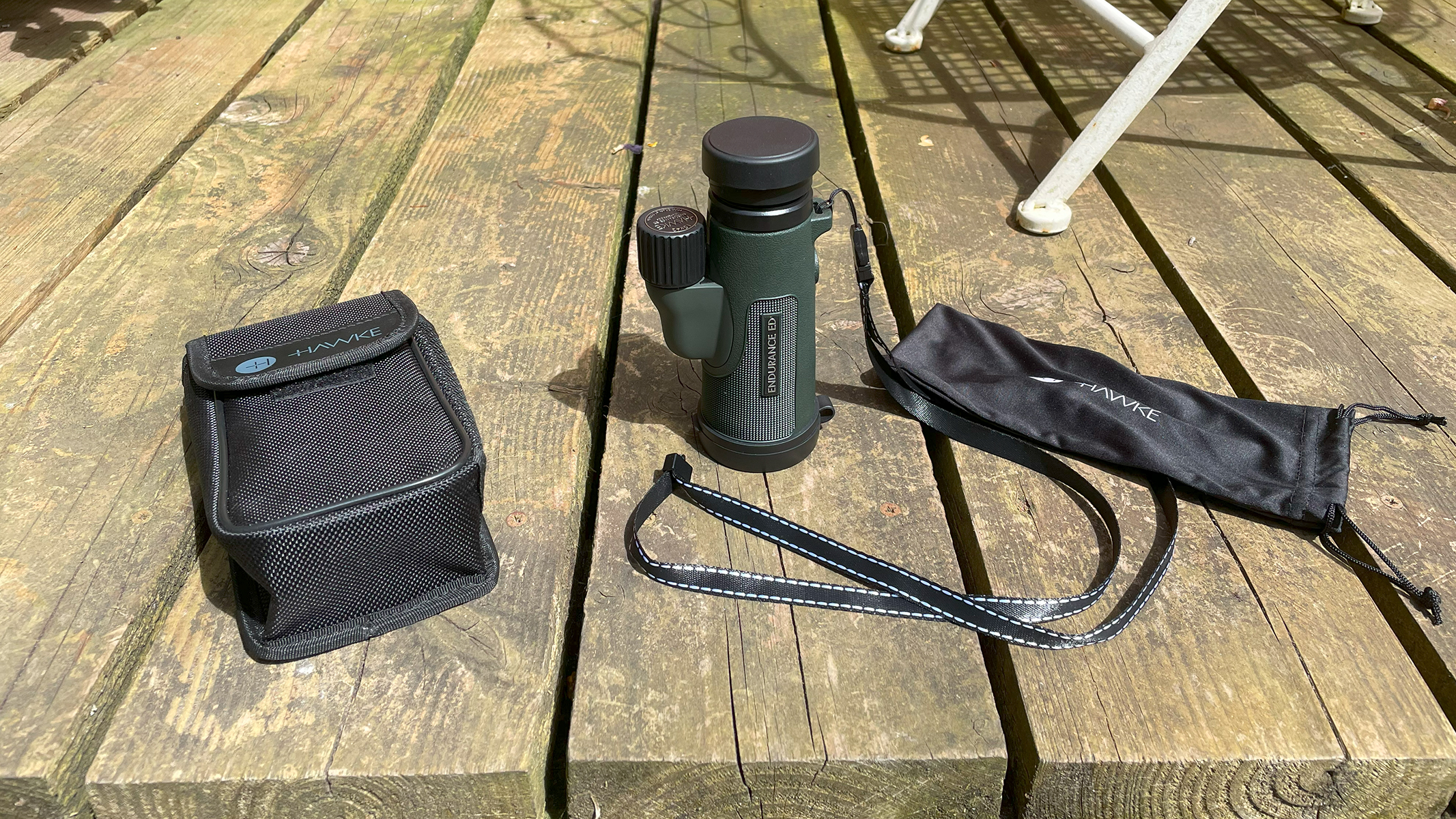 Hawk Endurance ED 10x42 next to the supplied pouch and strap.