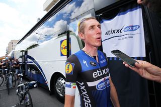 Dan Martin talking with the press at the team bus
