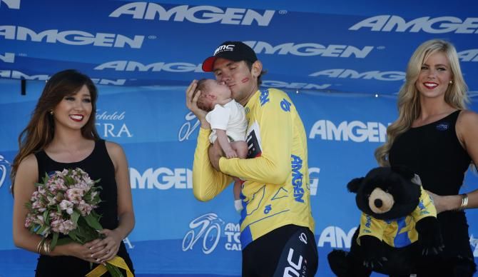Tejay van Garderen kisses his newborn daughter after winning the general classification at the Tour of California