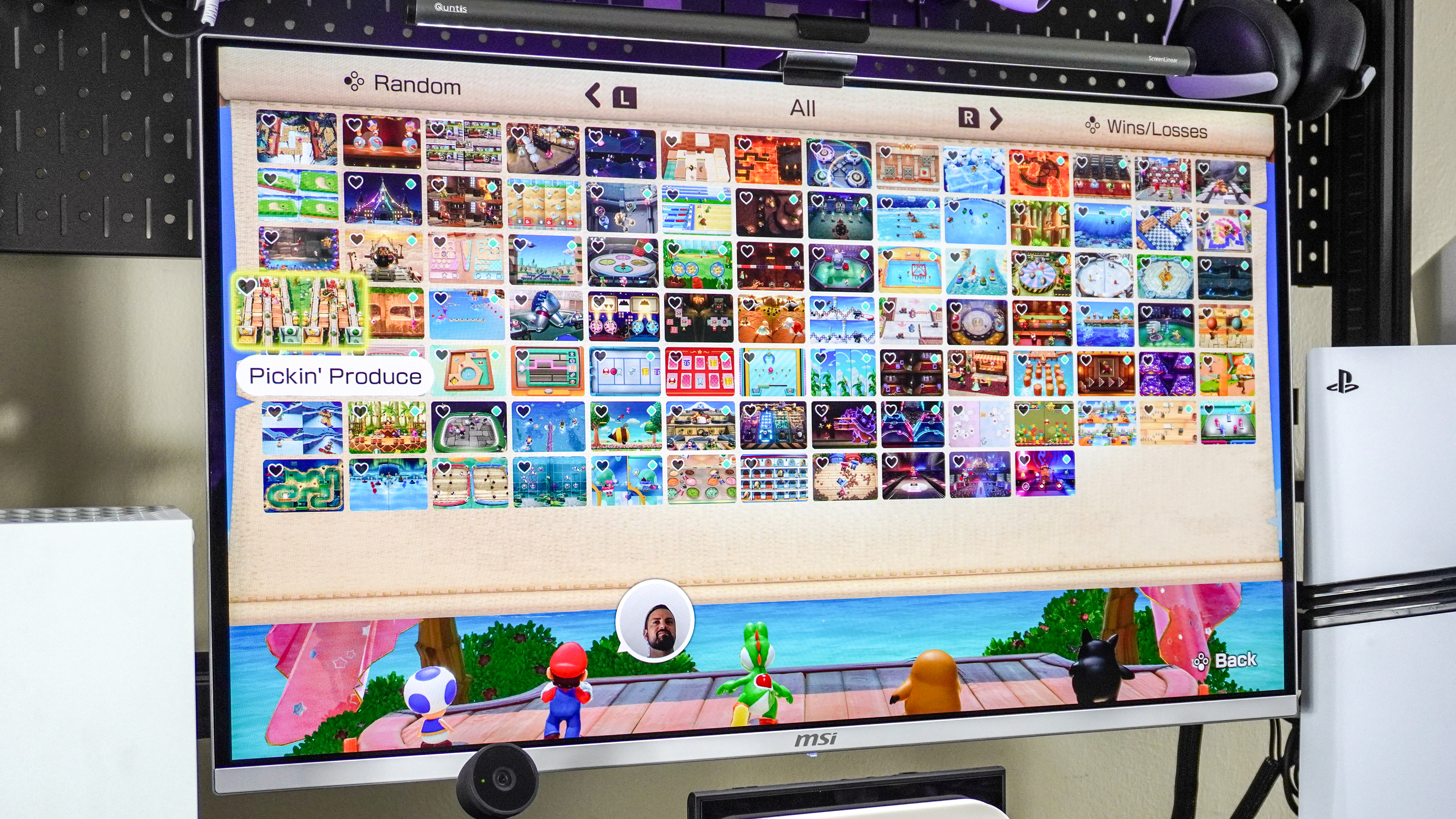 Super Mario Party Jamboree + Jamboree TV being played on a monitor with all of the game's minigames shown off on screen