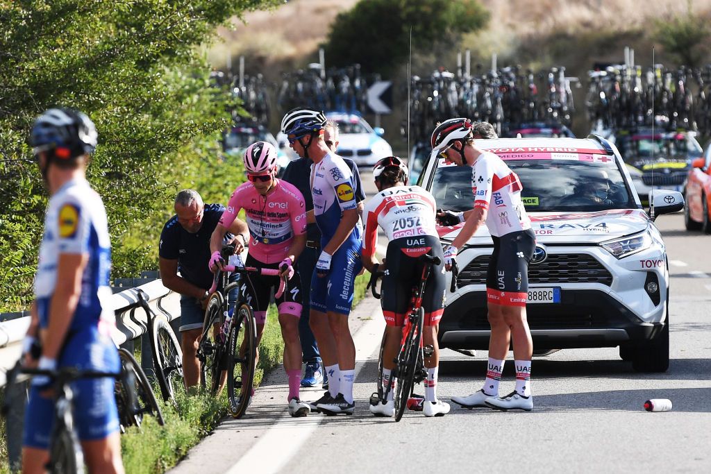 MATERA ITALY OCTOBER 08 Joao Almeida of Portugal and Team Deceuninck QuickStep Pink Leader Jersey Crash Alvaro Jose Hodeg Chagui of Colombia and Team Deceuninck QuickStep Fernando Gaviria Rendon of Colombia and UAE Team Emirates during the 103rd Giro dItalia 2020 Stage 6 a 188km stage from Castrovillari to Matera 401m girodiitalia Giro on October 08 2020 in Matera Italy Photo by Tim de WaeleGetty Images