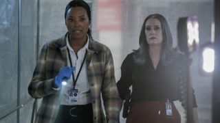 Aisha Tyler as Dr. Tara Lewis and Paget Brewster as Emily Prentiss walking side by side in Criminal Minds: Evolution