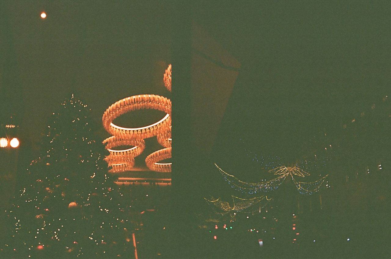 Two photos of a Christmas tree and Christmas lights taken on a Kodak Ektar H35 Half Frame film camera