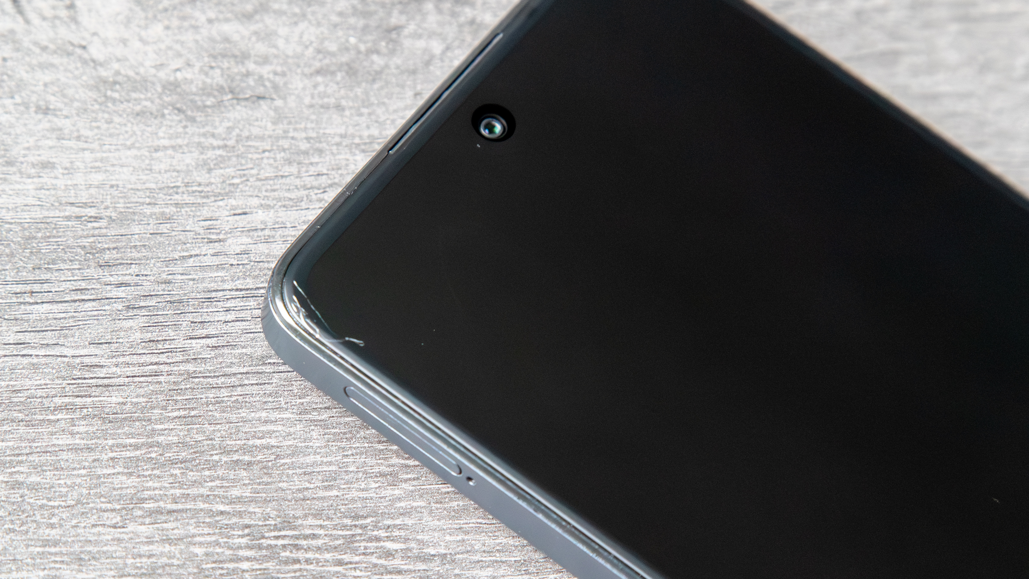 TCL 60 XE NXTPAPER display off with a scratch in the top corner