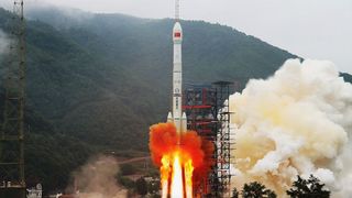 A Chinese Long March 3B rocket launches the military space debris mitigation satellite Shijian-21from the Xichang Satellite Launch Center on Oct. 24, 2021. Shijian-21 apparently met up with another Chinese satellite high above Earth in June 2025.