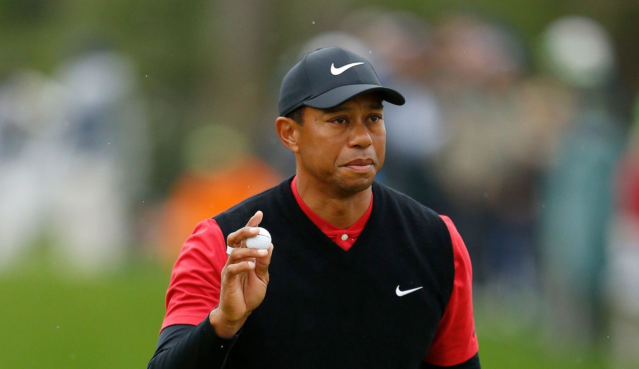 Tiger Woods waves to the crowd at The Players Championship