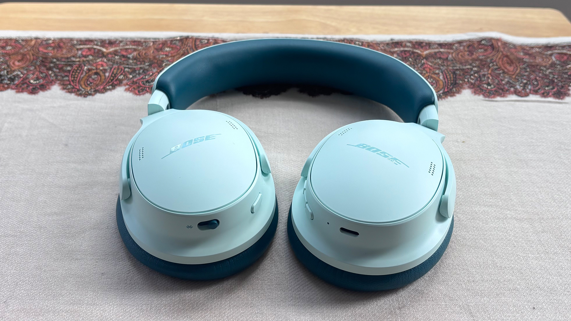 Bose QuietComfort Headphones (2nd Gen) over-ear headphones face down on white/grey fabric