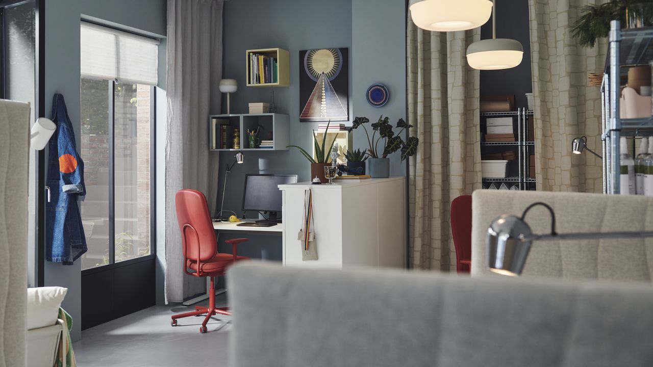 An office space with a shelving unit, an office chair, and a desk