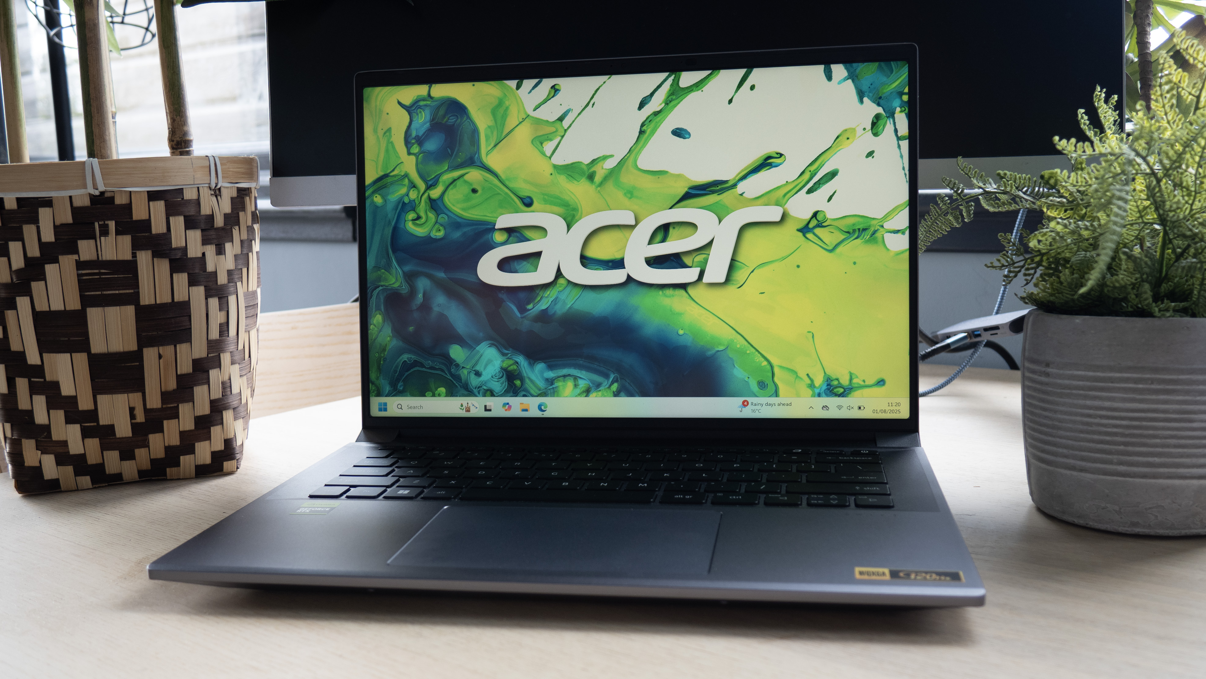An image of an Acer Swift X 14 laptop on a table