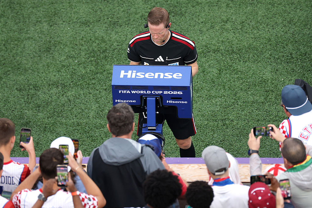 Drew Fischer performs a VAR review on the pitchside monitor