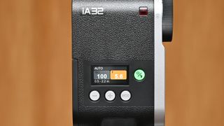 Godox iA32 product image, held in hand