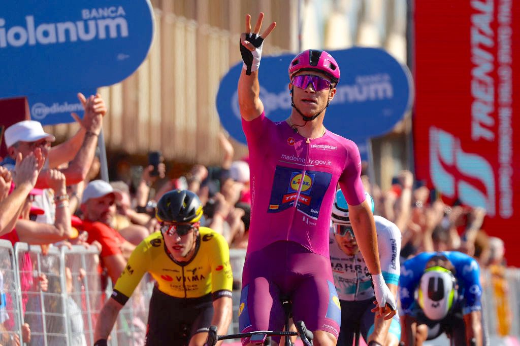 Best sprinter's cyclamen jersey Team Lidl-Trek's Italian rider Jonathan Milan celebrates as he crosses the finish line to win the 13th stage of the 107th Giro d'Italia cycling race, 179km between Riccione and Cento, on May 17, 2024. (Photo by Luca Bettini / AFP)
