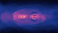 This still from a NASA simulation shows the glow from two supermassive black holes as they spiral toward each other ahead of a collision. 