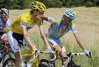 Andy Schleck and Alberto Contador share a word